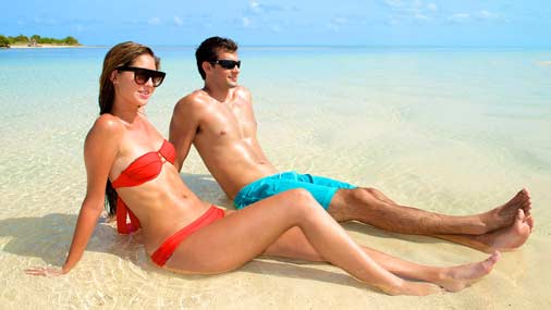 Image of couple relaxing on a Key west sandbar