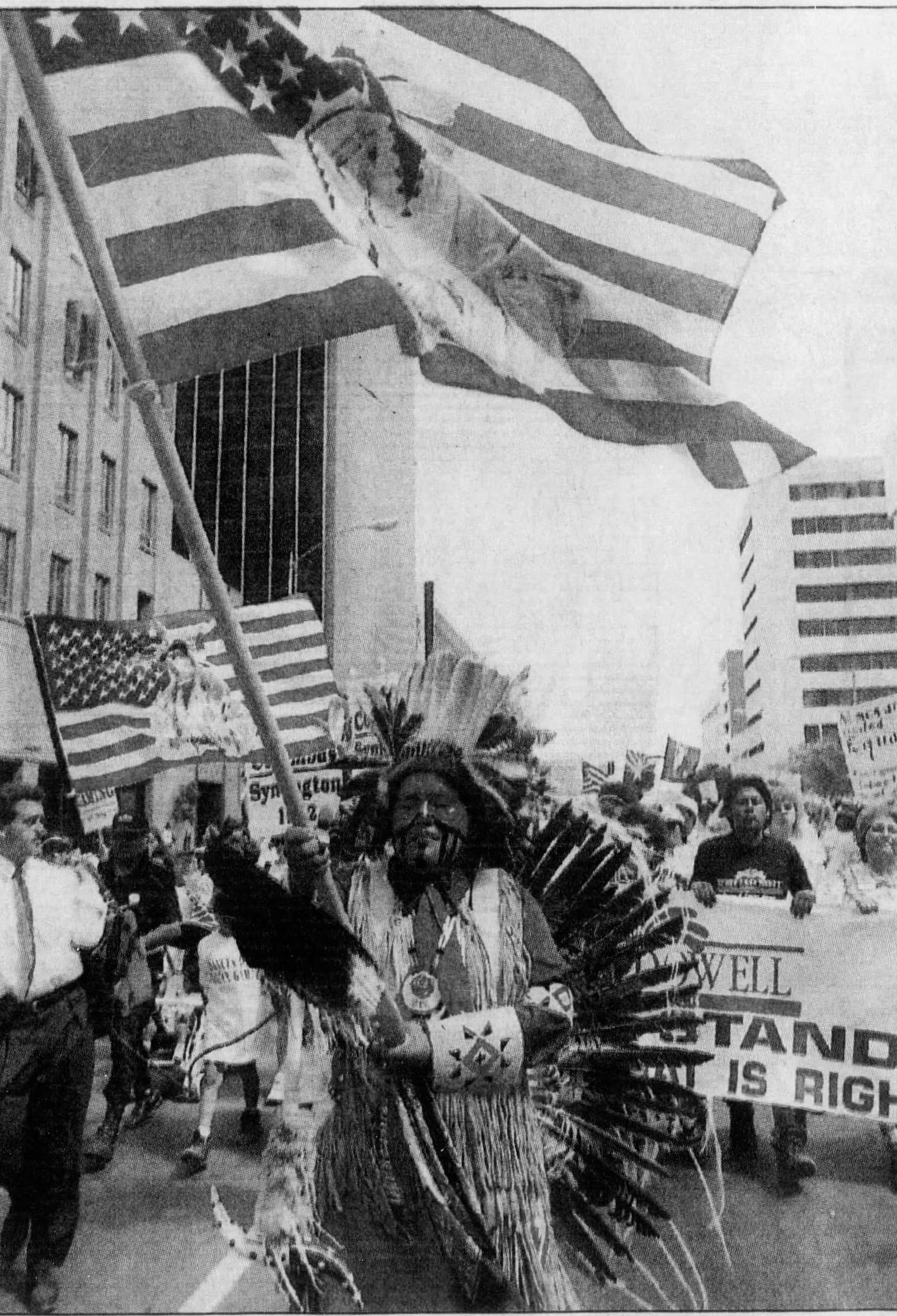 Chris Rhodes of Phoenix, clad in traditional northern Plains Indian regalia, joins a protest march to the state Capitol. Wednesday's Indian-gaming march and rally drew about 1,000 supporters. The events were triggered by last week's seizure of gaming machines on five reservations. (Published May 21, 1992)