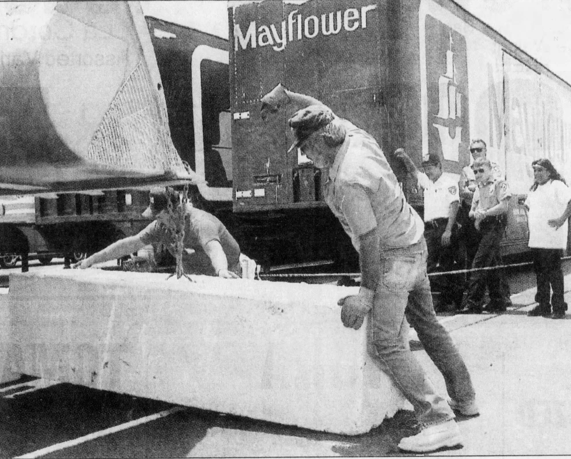 People set up barriers to barricade trucks holding gaming machines at the Fort McDowell Yavapai Nation.