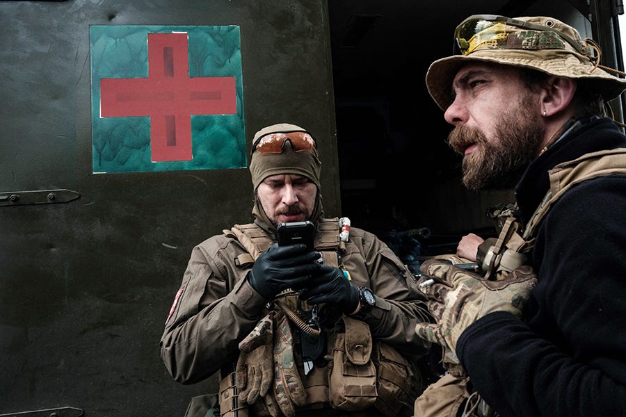 Andriy Kukhar, 37, left, a dentist and head of Lviv's White Berets, and Yuriy Kozhumyaka, 38, an artist teaching at the National Academy of Arts, are medical volunteers helping the army's mobile evacuation unit near Lysychansk, eastern Ukraine, on May 10.