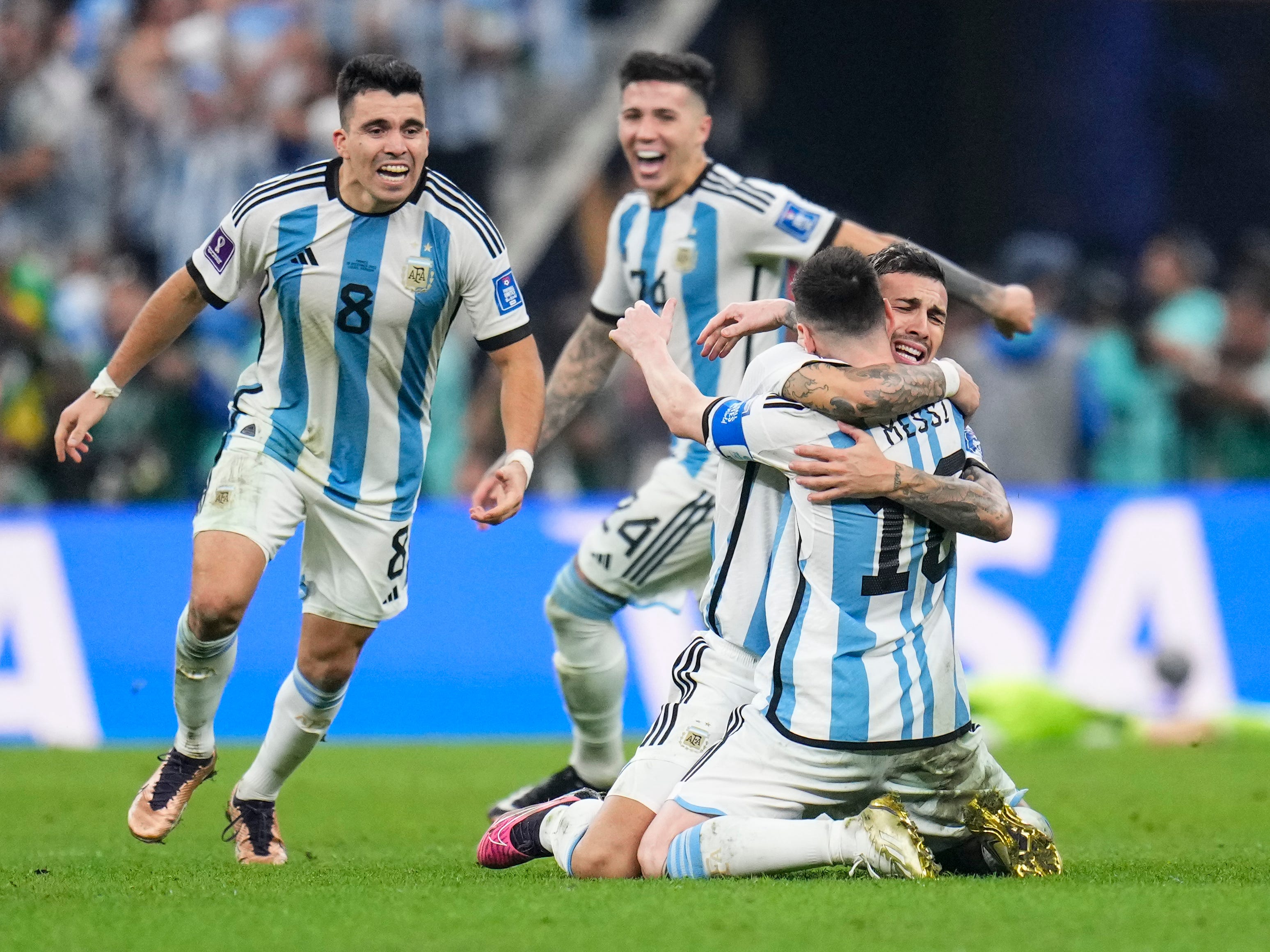 Argentina's players celebrate winning the World Cup final.