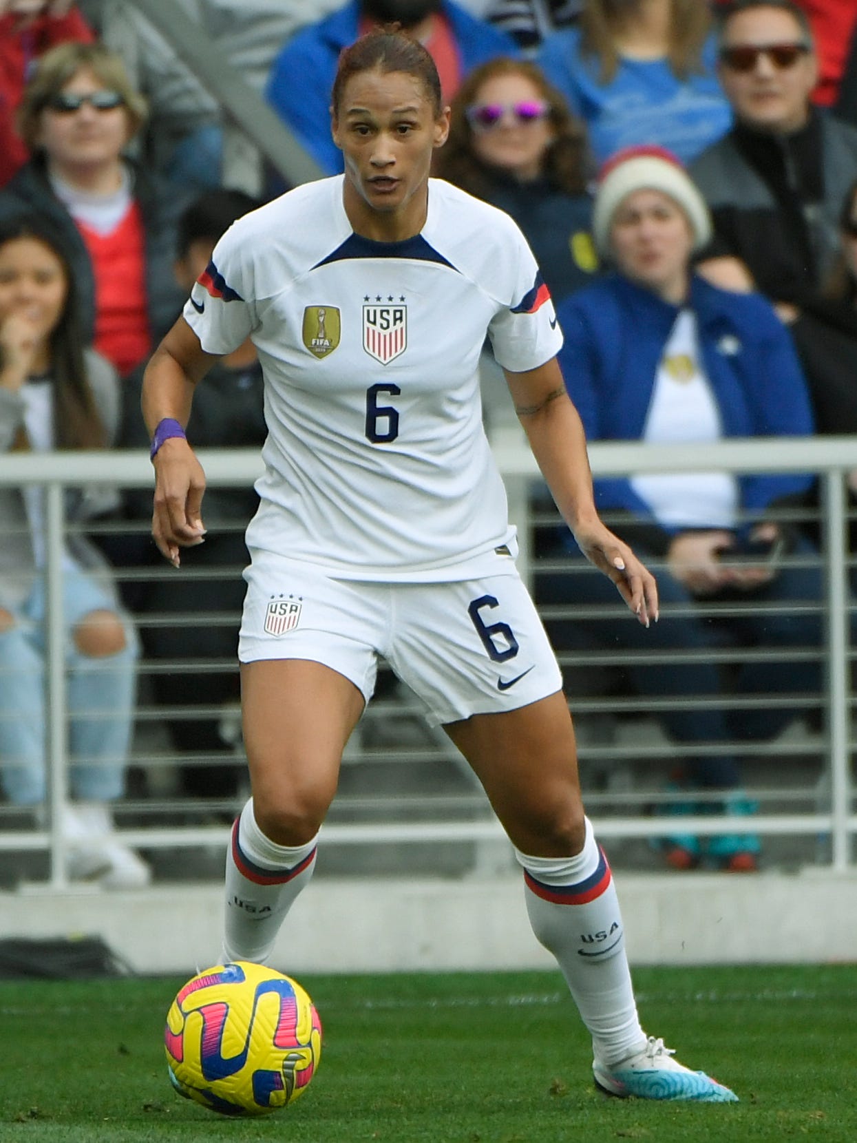 An action image of Lynn Williams playing soccer.