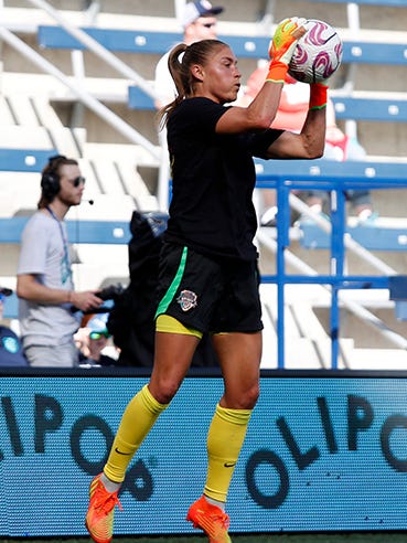 An action image of Aubrey Kingsbury playing soccer.