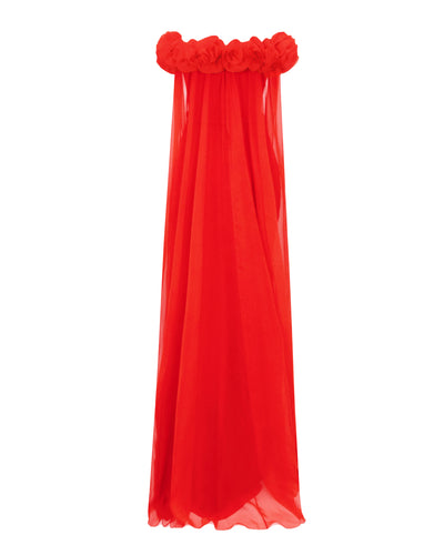 The back of a draped flower embellishment off-the-shoulders, straight-cut red evening dress, with a flowy chiffon cape-like sleeves.