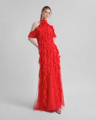 A halter-neck red evening dress featuring dropped sleeves and laser-cut embellishments.