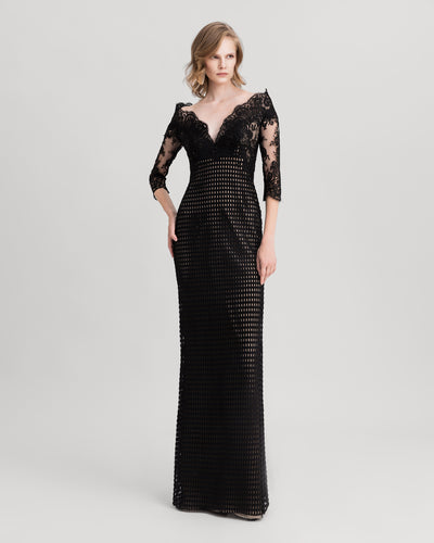 An off-the-shoulders, V-neckline black crochet lace evening dress.