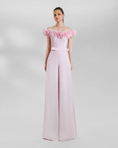 An evening wear pink set featuring an Off-the-shoulders corset with rushed details on the neckline paired with wide high-waist pants.