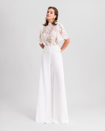 A white evening wear set featuring a high-collar lace top with flared sleeves paired with flared pants.