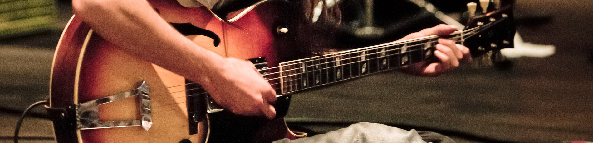 Man playing guitar at a Hard Rock