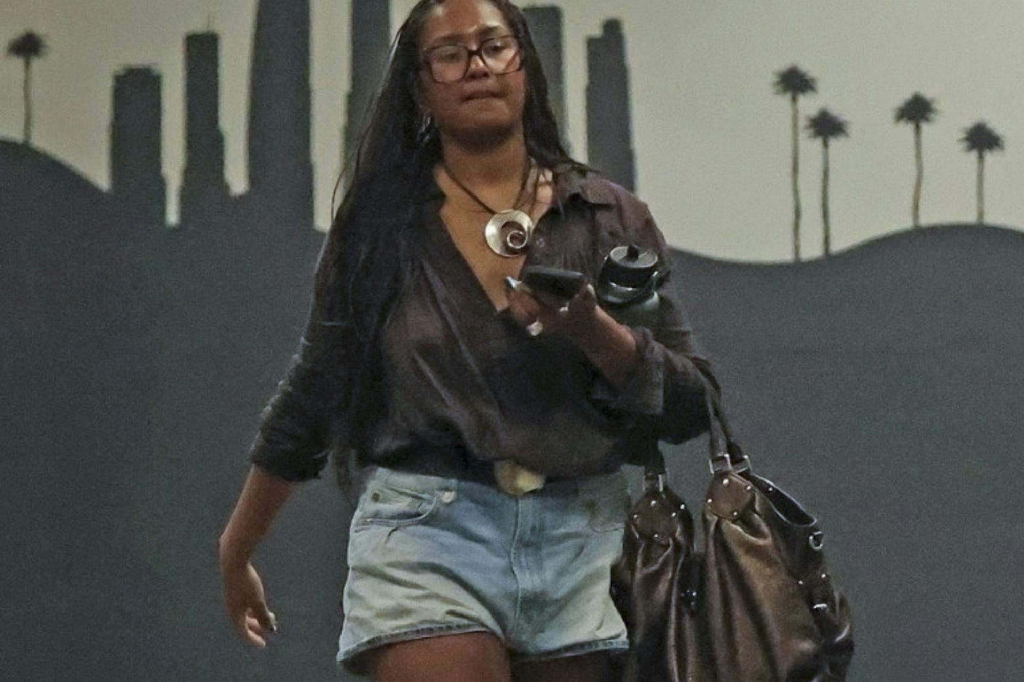 Sasha Obama in Los Angeles wearing jean shorts and mule slippers