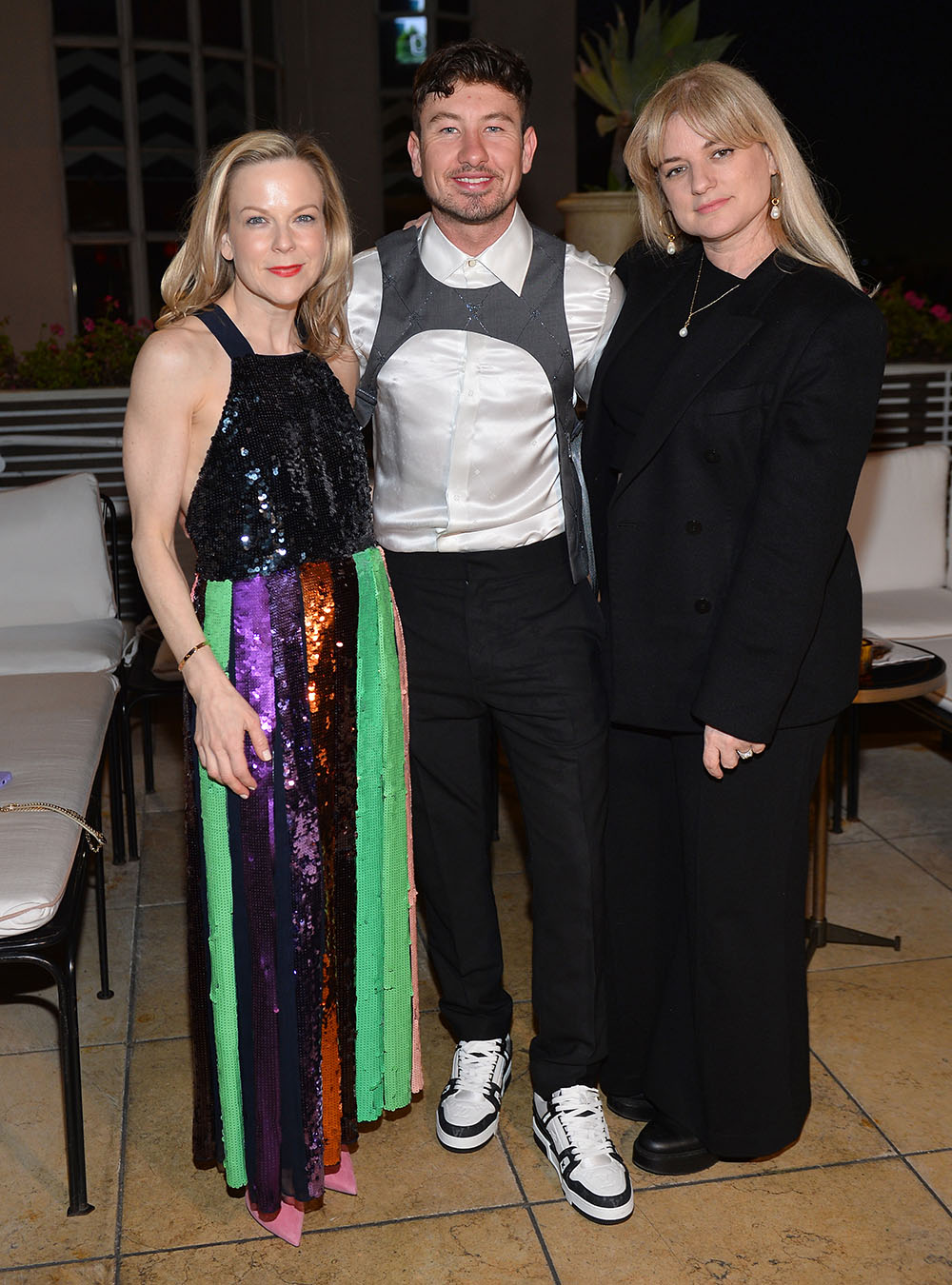 (L-R) Carol McColgin, Barry Keoghan, and Ilaria Urbinati attend The Hollywood Reporter And Jimmy Choo Power Stylists Dinner at The Terrace at Sunset Tower on March 28, 2023 in West Hollywood, California.