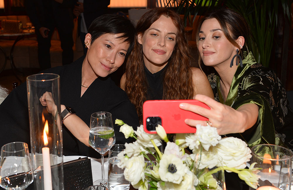 (L-R) Sandra Choi, Riley Keough, and Jamie Mizrahi attend The Hollywood Reporter And Jimmy Choo Power Stylists Dinner at The Terrace at Sunset Tower on March 28, 2023 in West Hollywood, California.