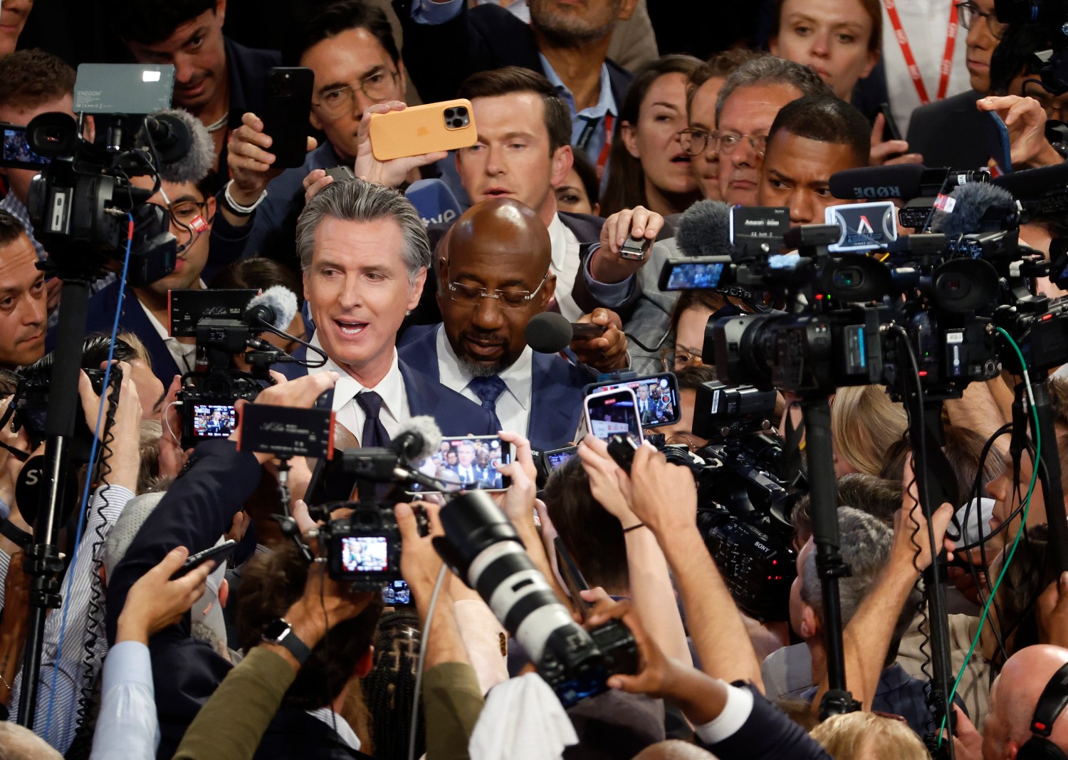 Gov. Gavin Newsom (D-CA) and Sen. Raphael Warnock (D-GA) speak to reporters in the spin room following the CNN Presidential Debate between U.S. President Joe Biden and Republican presidential candidate, former U.S. President Donald Trump at the McCamish Pavilion on the Georgia Institute of Technology campus on June 27, 2024 in Atlanta, Georgia. President Biden and former President Trump are faced off in the first presidential debate of the 2024 campaign.