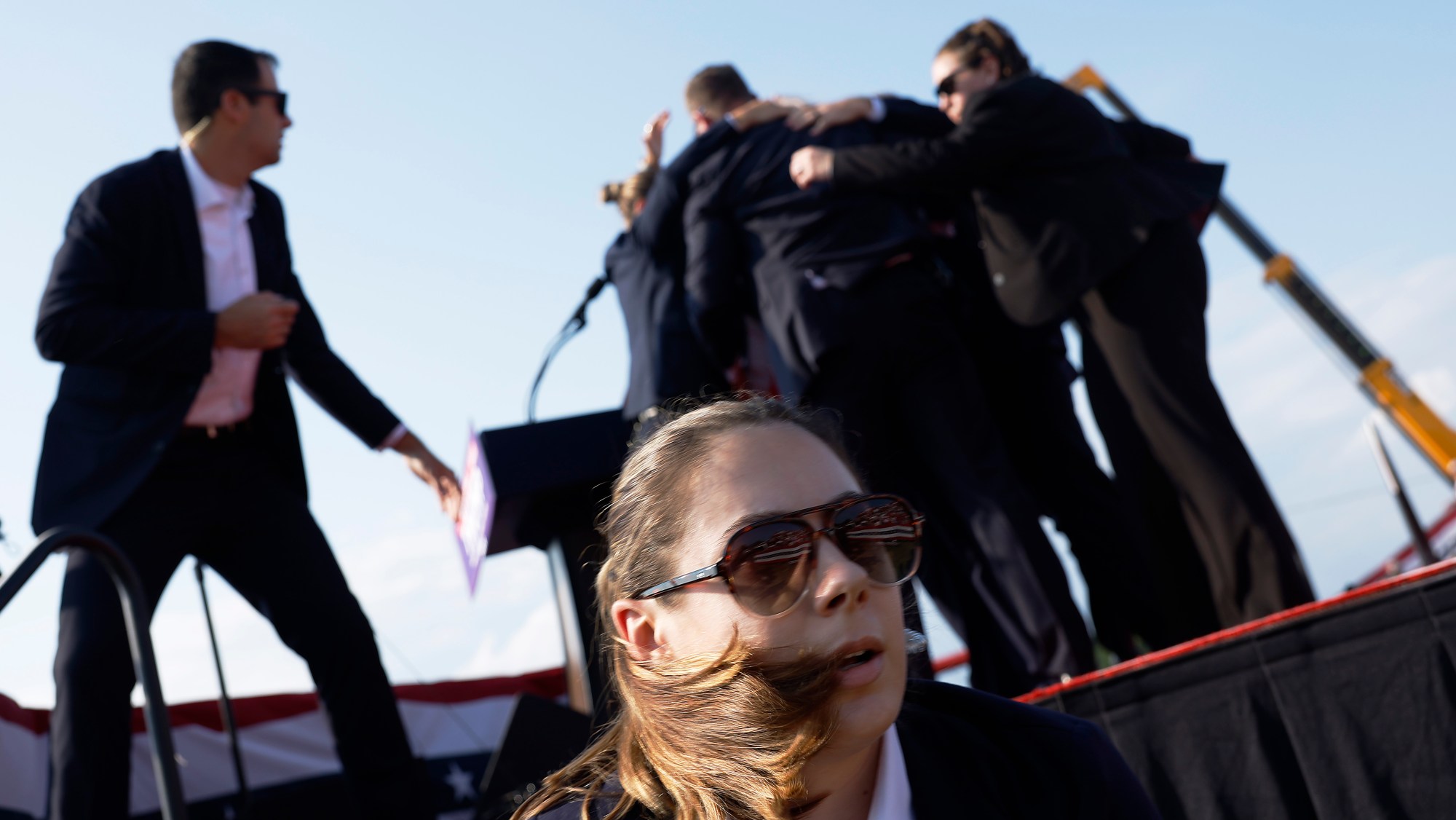 Donald Trump is rushed offstage by U.S. Secret Service agents after being grazed by a bullet during a rally on July 13, 2024, in Butler, Pennsylvania.