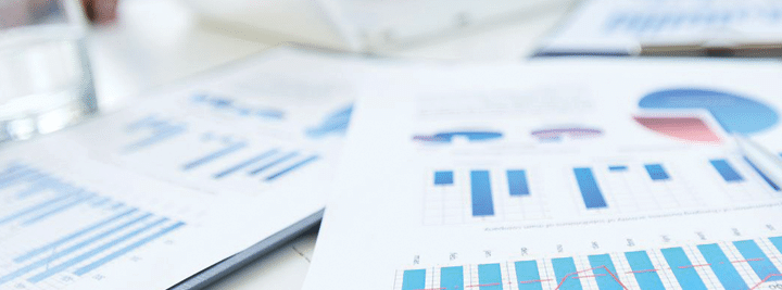 financial papers and graphs