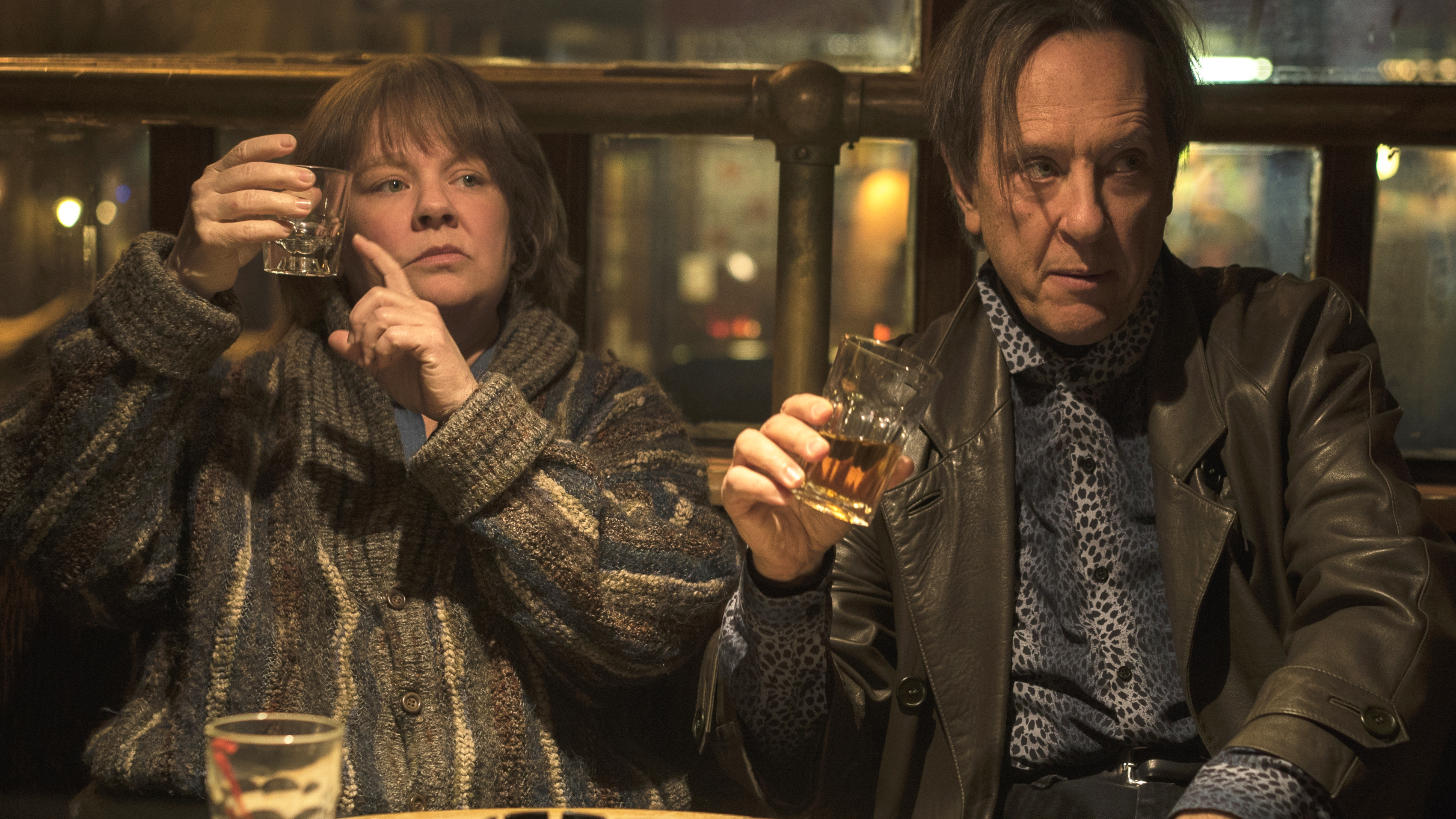 Melissa McCarthy as "Lee Israel" and Richard E. Grant as "Jack Hock" in the film CAN YOU EVER FORGIVE ME? Photo by Mary Cybulski. © 2018 Twentieth Century Fox Film Corporation All Rights Reserved