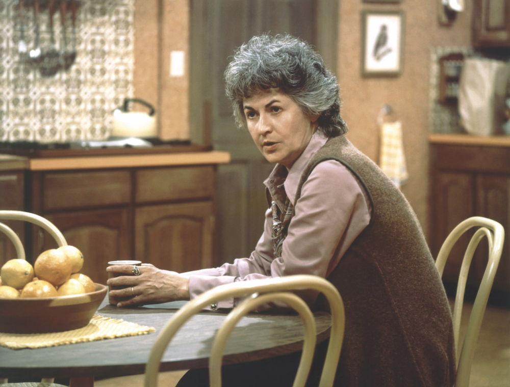 'Maude' stars Bea Arthur, shown here sitting at a kitchen table holding a cup of coffee