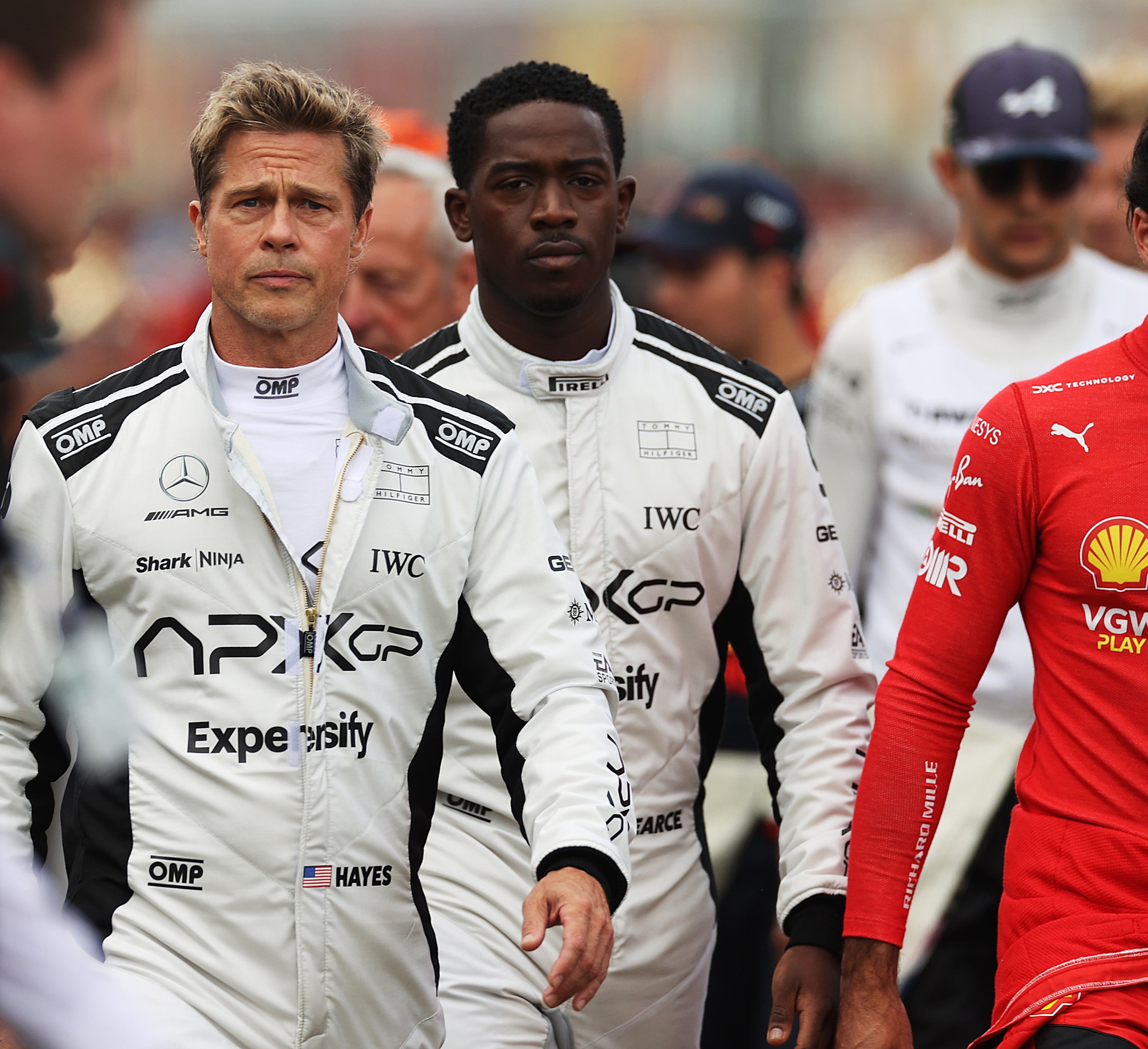 NORTHAMPTON, ENGLAND - JULY 09: Brad Pitt, star of the upcoming Formula One based movie, Apex, and Damson Idris, co-star of the upcoming Formula One based movie, Apex, walk on the grid during the F1 Grand Prix of Great Britain at Silverstone Circuit on July 09, 2023 in Northampton, England. (Photo by Ryan Pierse/Getty Images)