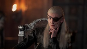 A man with long, silvery blond hair and an eyepatch; Ewan Mitchell in 'House of the Dragon'