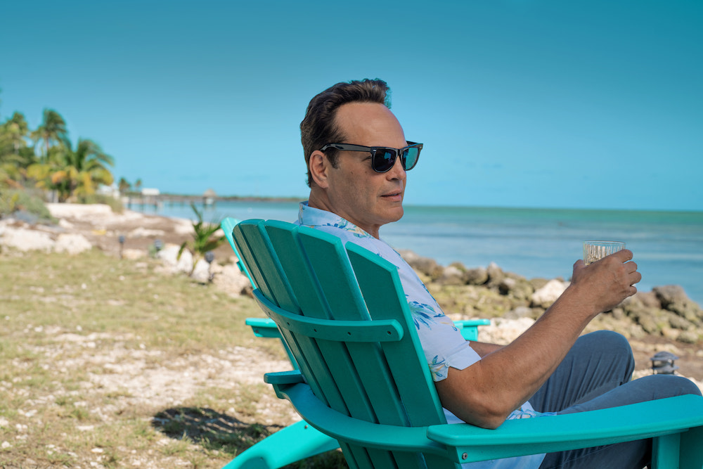 Vince Vaughn in 'Bad Monkey,' shown here sitting in a turquoise chair overlooking the ocean