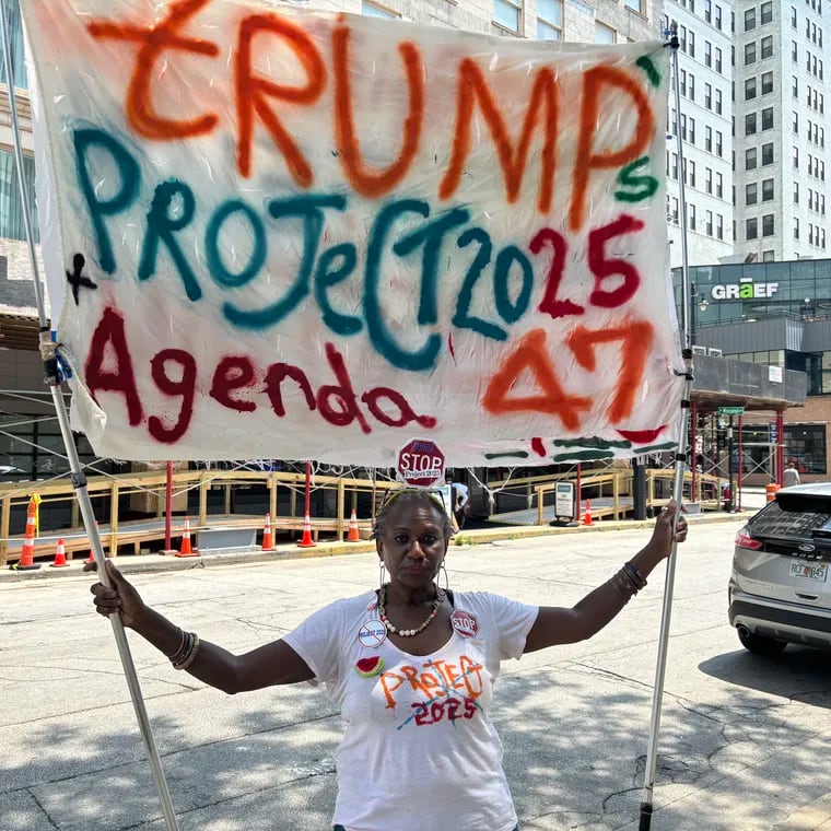 Nadine Seiler, a 59-year-old activist from Waldorf, Md., protests Donald Trump and Project 2025 on Tuesday, blocks away from the Republican National Convention in Milwaukee.