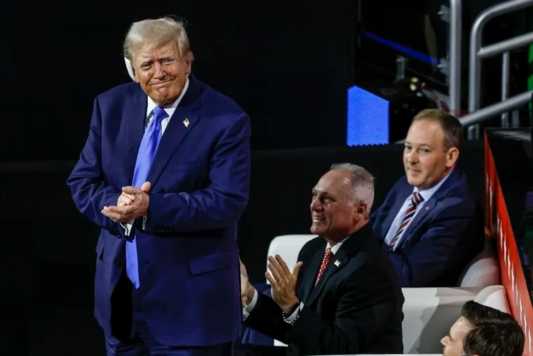 Former President Donald Trump stands as he's recognized during the Republican National Convention at the Fiserv Forum Arena in Milwaukee on Tuesday.