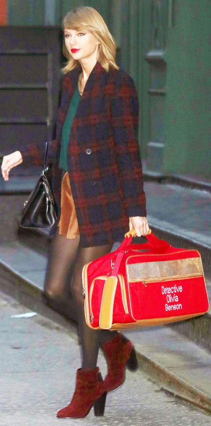 Taylor Swift in a plaid wool coat over a teal top and Brandy Melville corduroy skirt