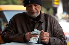 Man counting US dollar bills