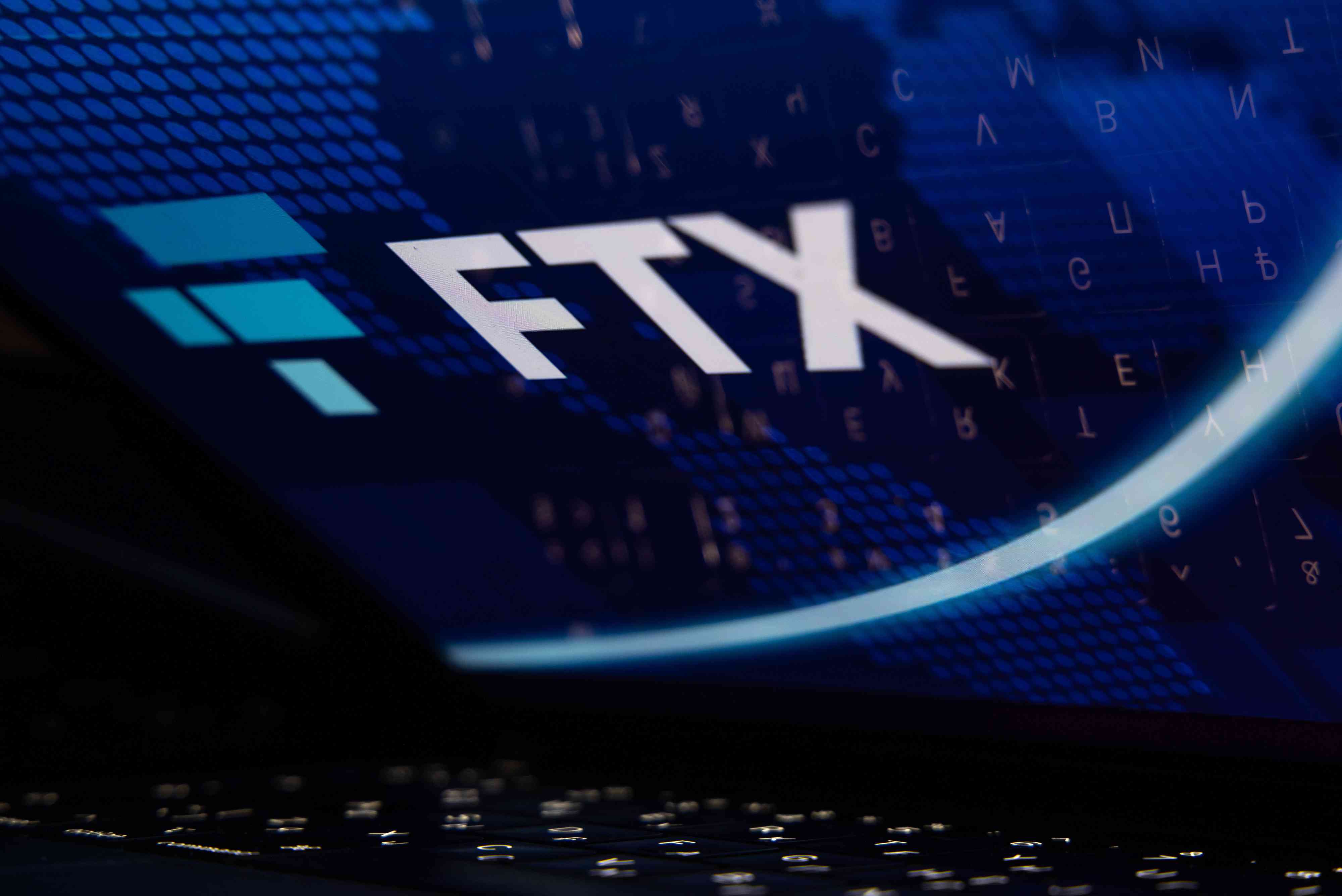 The FTX Cryptocurrency Derivatives Exchange logo on a laptop screen