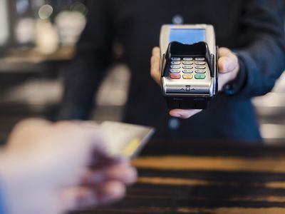 Man Using Credit Card Reader