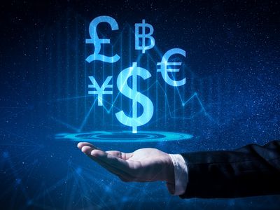 The abstract image of the business man hold the virtual hologram on hand. The concept of currency, financial, online, businessman, information technology and internet of things.