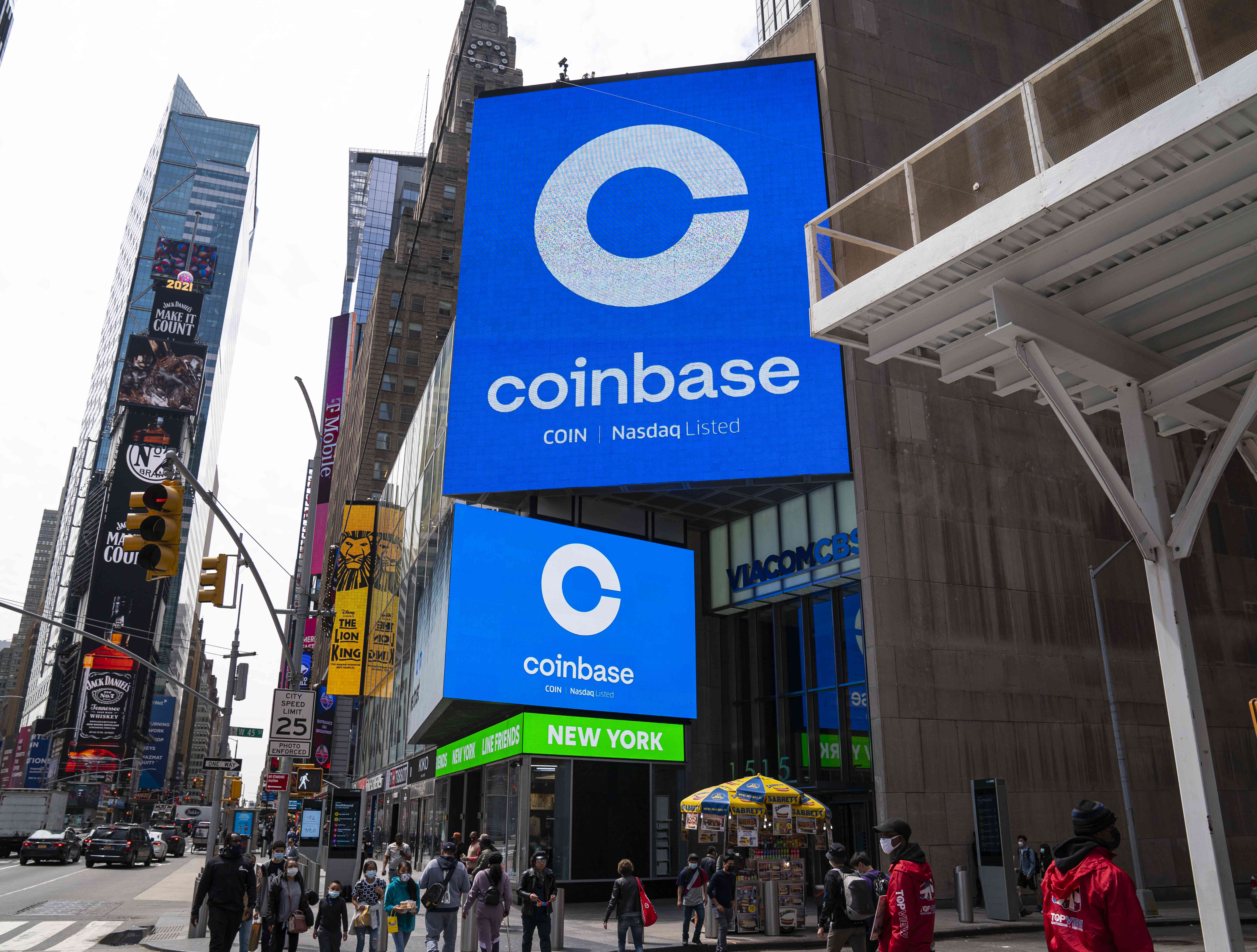 Coinbase signage during the company's initial public offering (IPO) at the Nasdaq market site April 14, 2021 in New York City. 