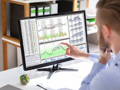 Trader analyzing financial charts