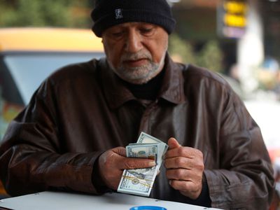 Man counting US dollar bills