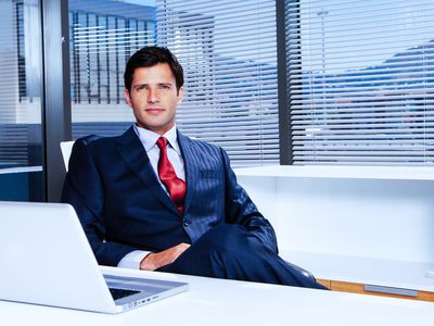 businessman sitting in front of a desk in the office.