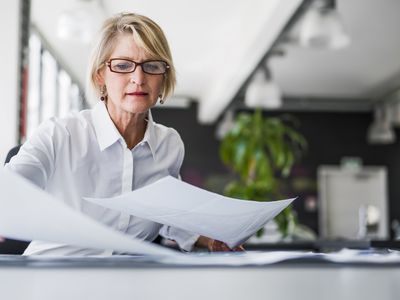 Person reviewing paperwork.