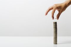 Woman stacking coins