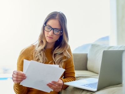 A homeowner looks over her mortgage statement. 