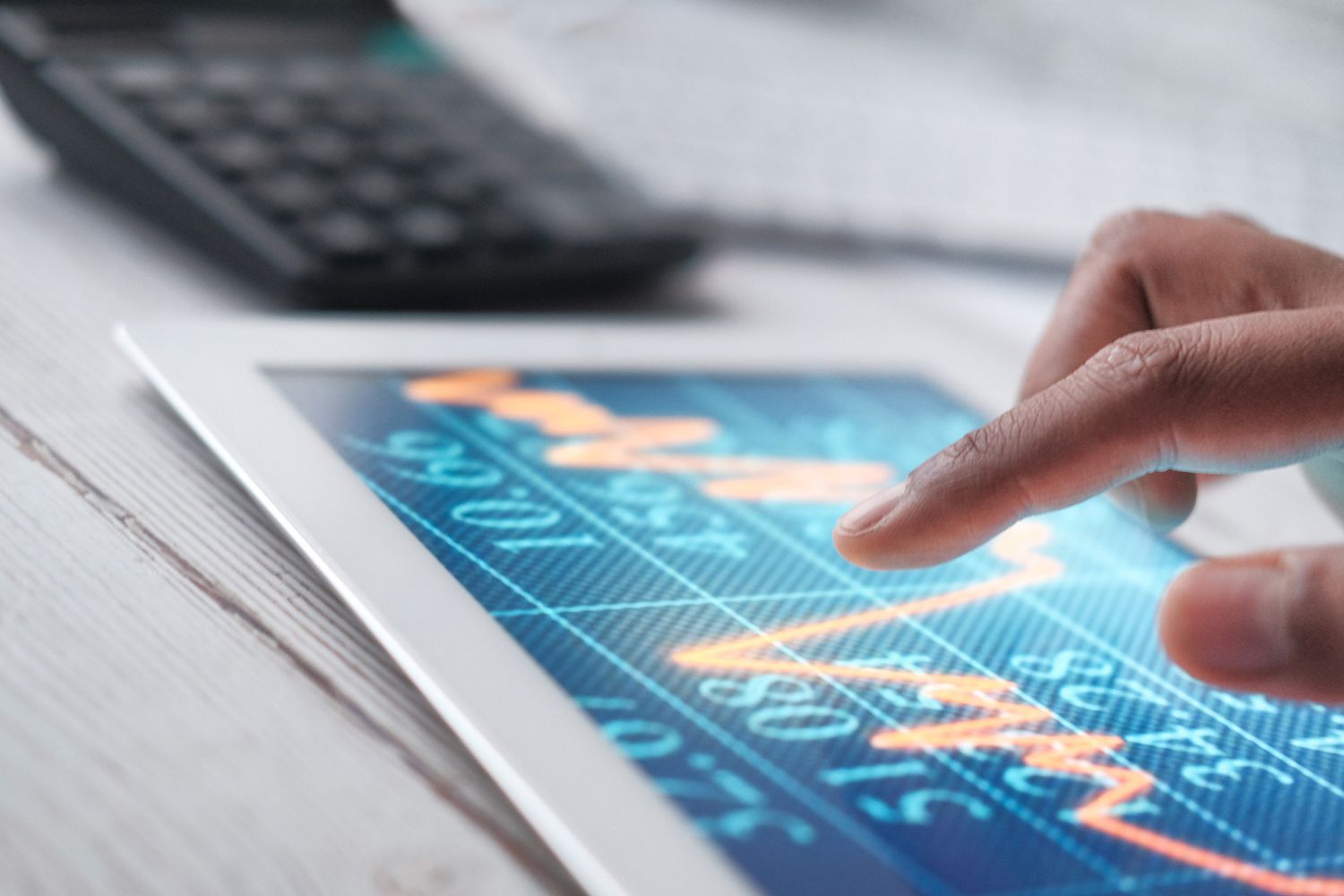 Man Hand With Digital Tablet Analyzing Stock Market Growth