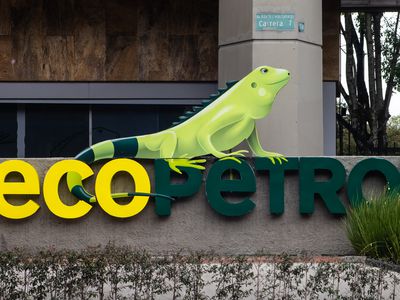 An Ecopetrol sign, with the company's iguana logo, appears outside a building.