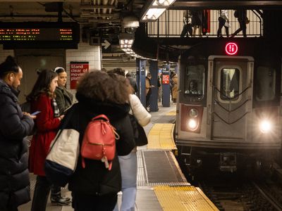 Commuters wait for a train at the Union Square station in New York, US, on Wednesday, Dec. 6, 2023.