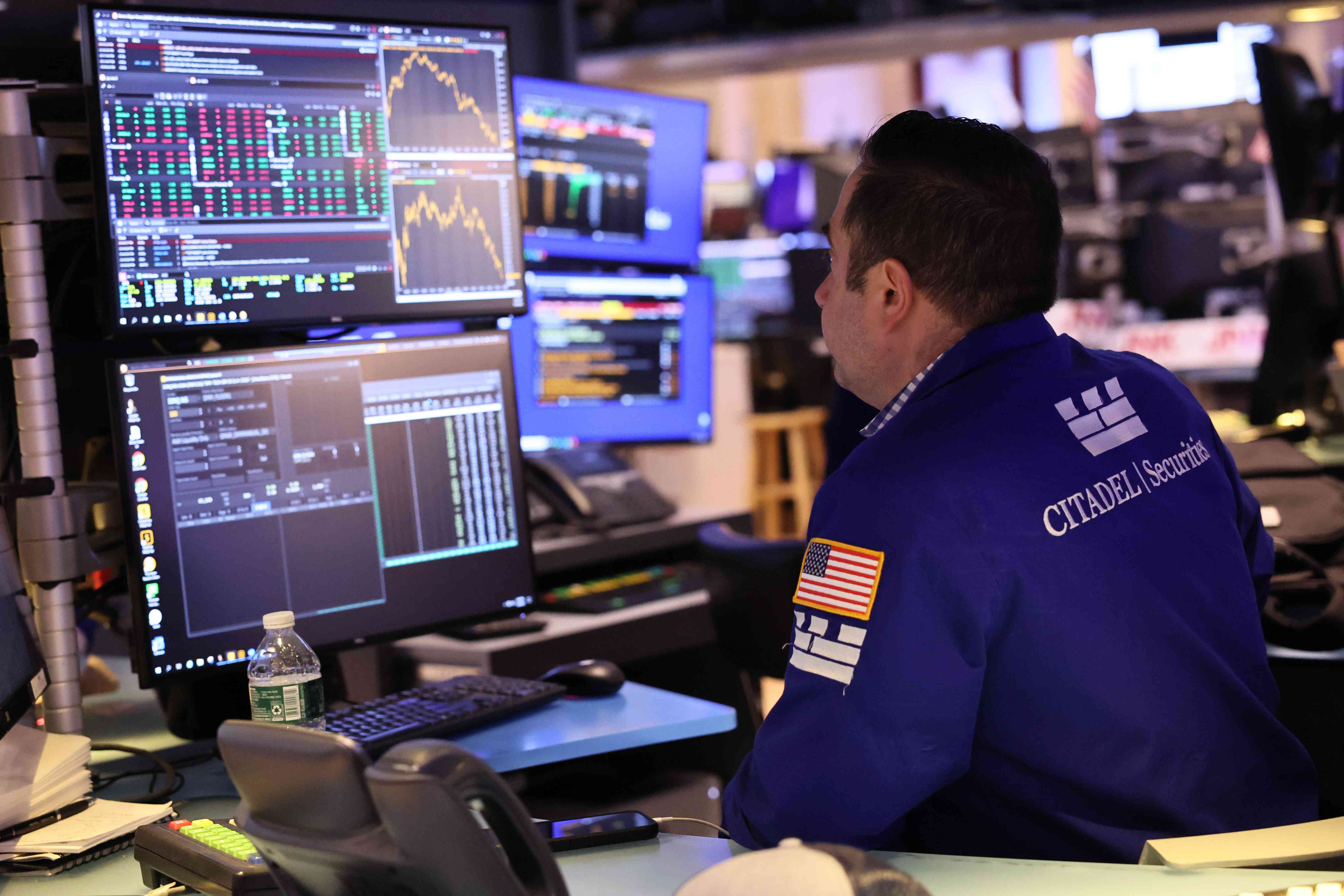 A trader works on the floor of the New York Stock Exchange.