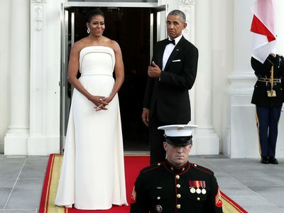 First Lady Michelle Obama and President Obama in formal dress in front of White House