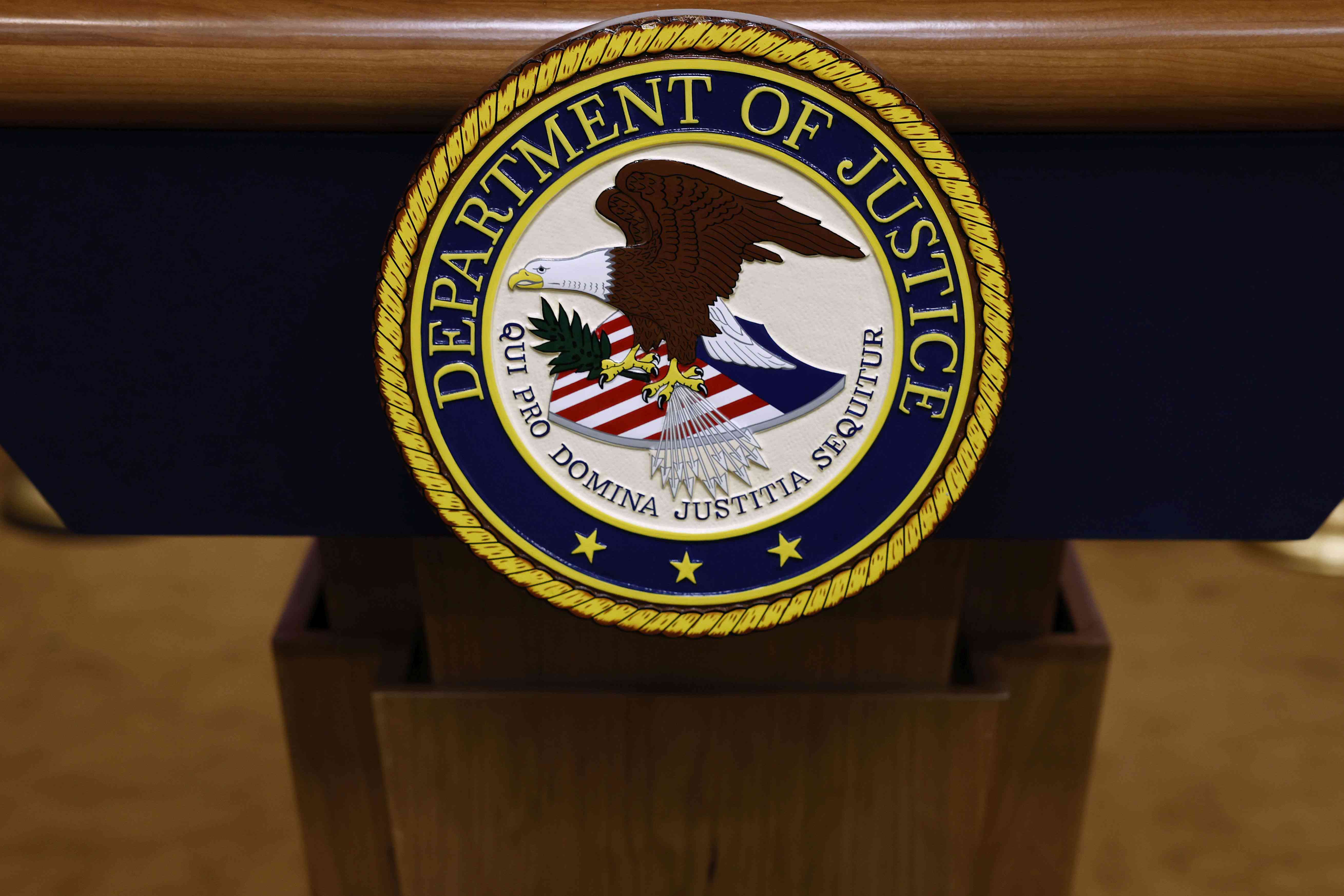 U.S. Department of Justice seal on a podium