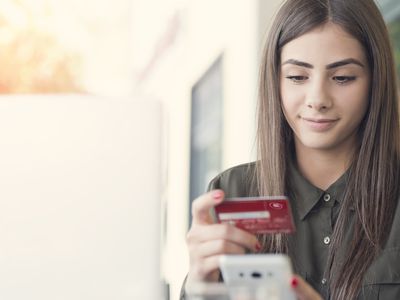 Girl shopping online using a credit card