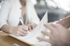 Woman Signing Contract