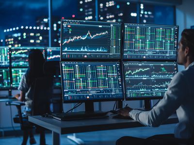 Traders working with multiple monitors