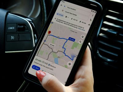 Woman's hand holding a mobile device showing google maps