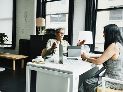 Financial advisor in discussion with a client in an office