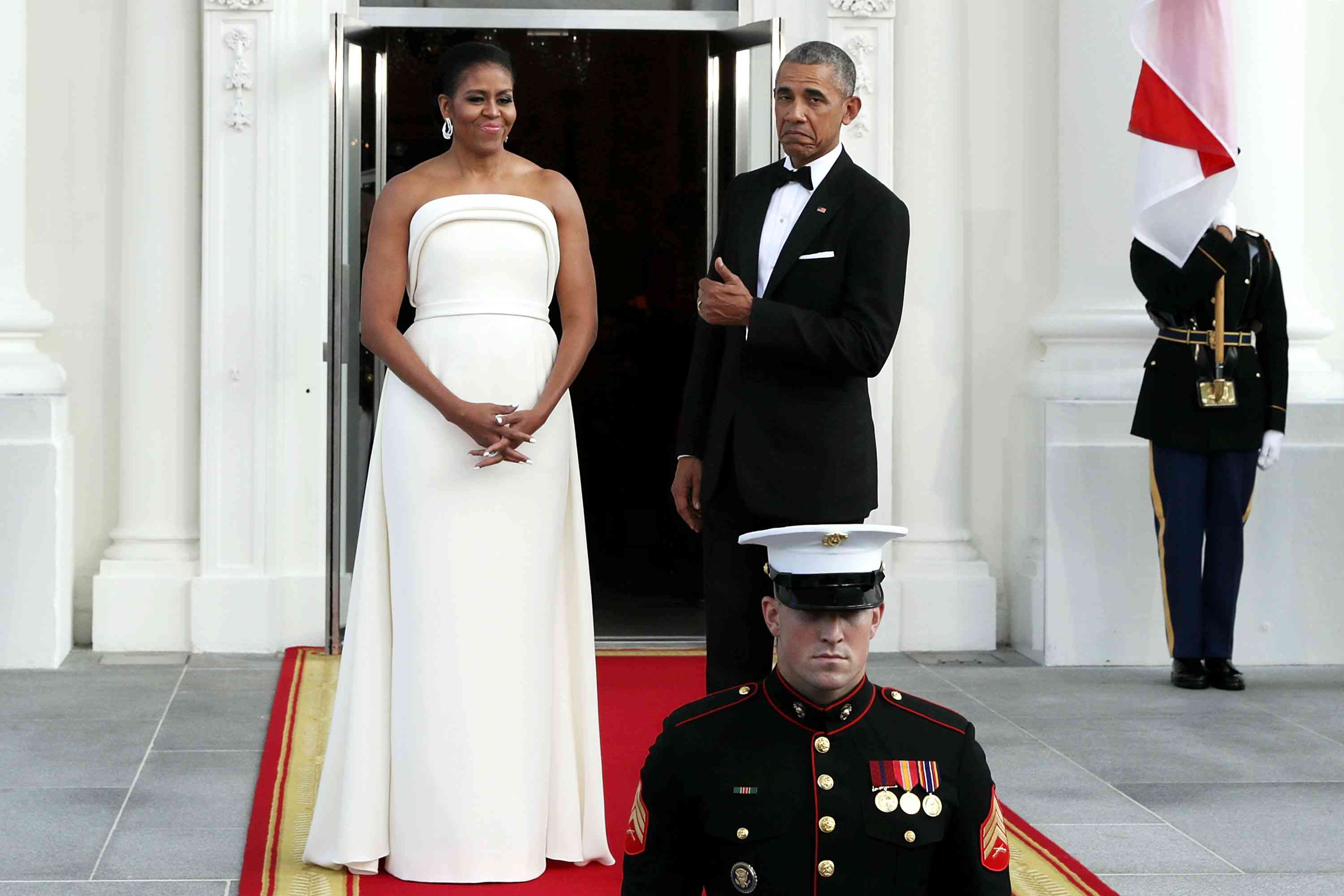 First Lady Michelle Obama and President Obama in formal dress in front of White House